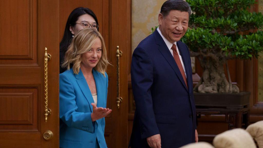 Chinese President Xi Jinping arrives with Italian prime minister Giorgia Meloni for a meeting at the Diaoyutai State Guesthouse