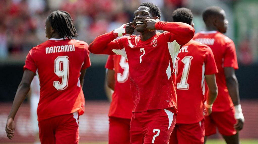 Breel Embolo celebrates with Switzerland team-mates after scoring
