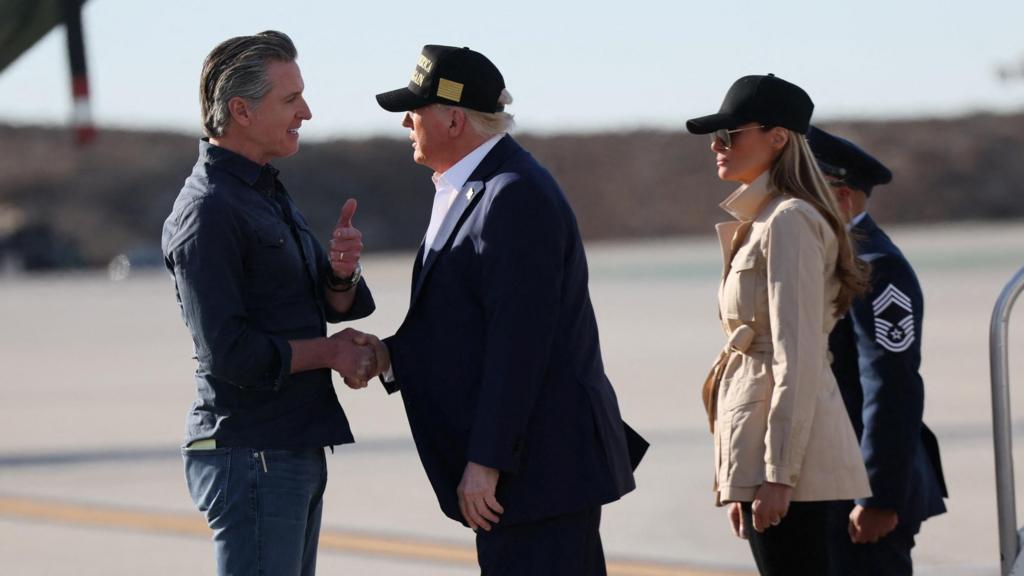 U.S. President Donald Trump greets Governor of California Gavin Newsom as he arrives to tour areas impacted or destroyed by the southern California wildfires, at Los Angeles International Airport in Los Angeles,