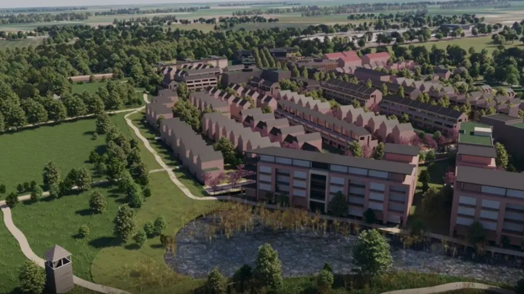 A CGI image of how Otterpool Park could look, with a mixture of semi detached houses, flat blocks and large green open spaces. 