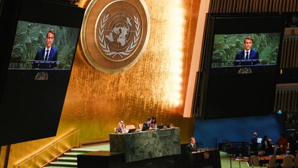 French President Emmanuel Macron addresses delegates during a high-level meeting of heads of state on a two-state solution between Israel and the Palestinians at United Nations