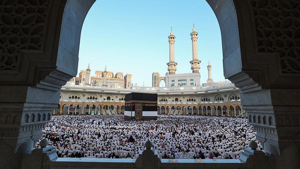 Muslims participate in a special morning prayer around the Kaaba during Hajj in 2025.