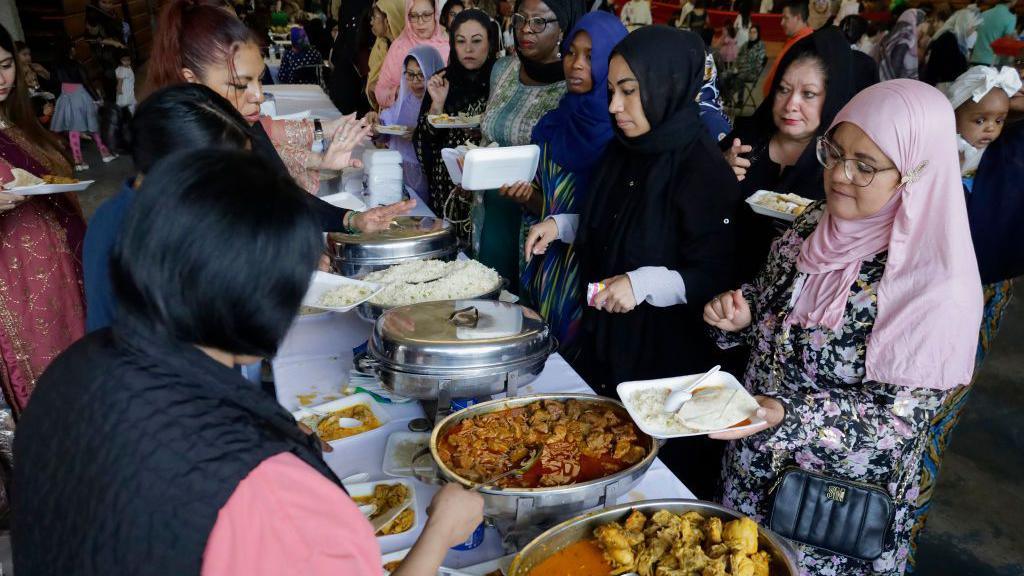 Women queuing up for food