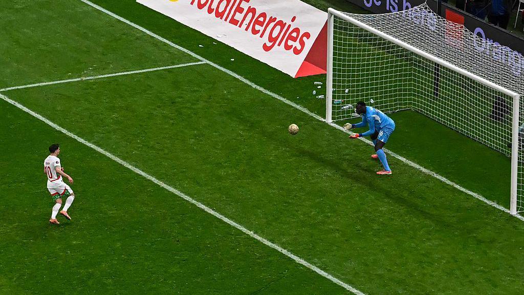 Morroco's Brahim Diaz clips his penalty in 'Panenka' style straight into the arms of Senegal goalkeeper Edouard Mendy