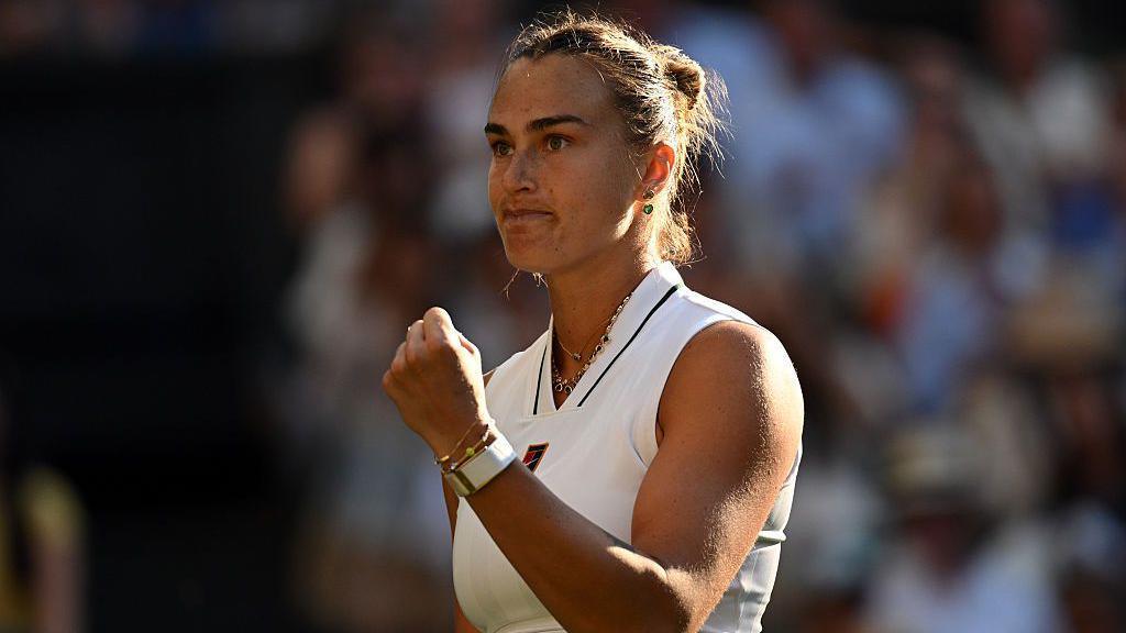Aryna Sabalenka celebrates victory over Jelena Ostapenko