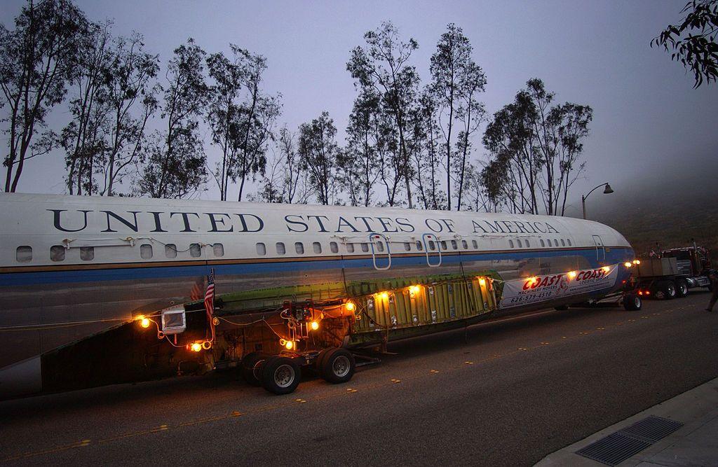 The fuselage of Air Force One being transported on a road