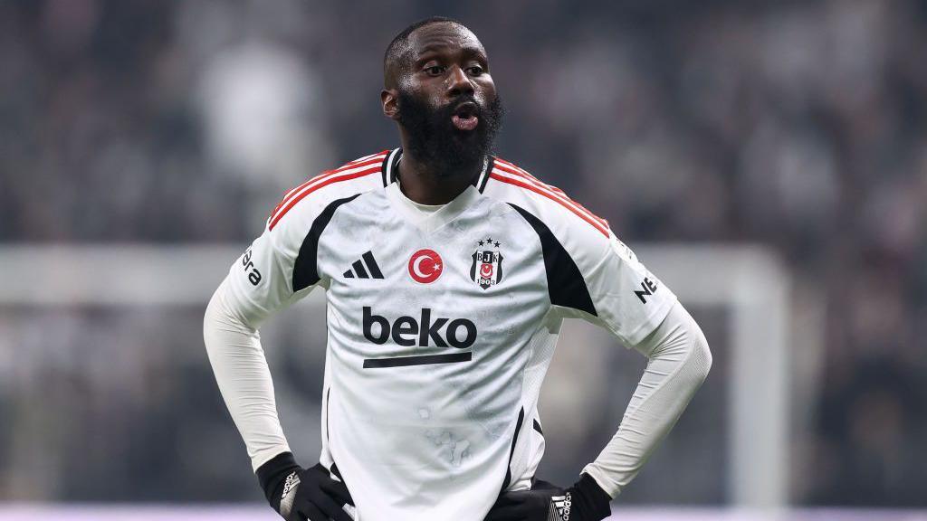 Arthur Masuaku stood with his hands on his hips while playing for Besiktas 