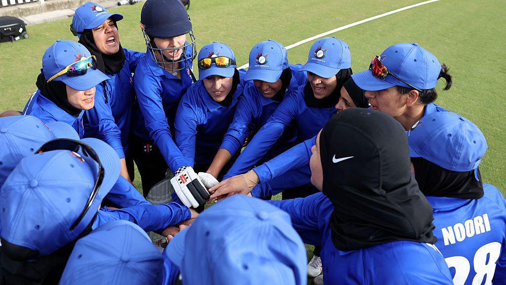 Afghanistan's women in a huddle during a match in Australia
