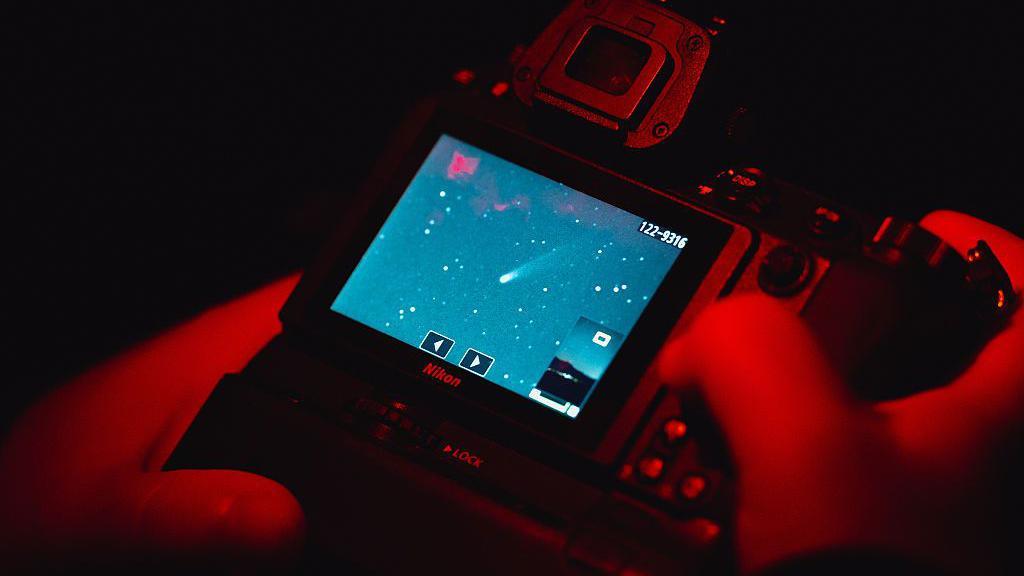 Stargazer checks the images on the back of his digital camera