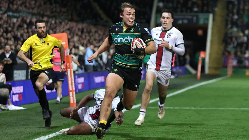 Tom Litchfield scores a try in the corner for Northampton Saints