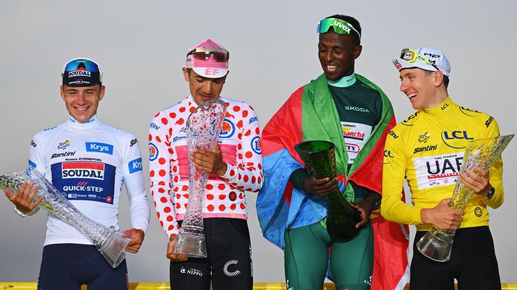 Remco Evenepoel wearing White Best Young Rider Jersey, Richard Carapaz wearing Polka Dot Mountain Jersey, Biniam Girmay wearing Green Sprint Jersey and Tadej Pogacar wearingthe Yellow Leader Jersey in 2024.