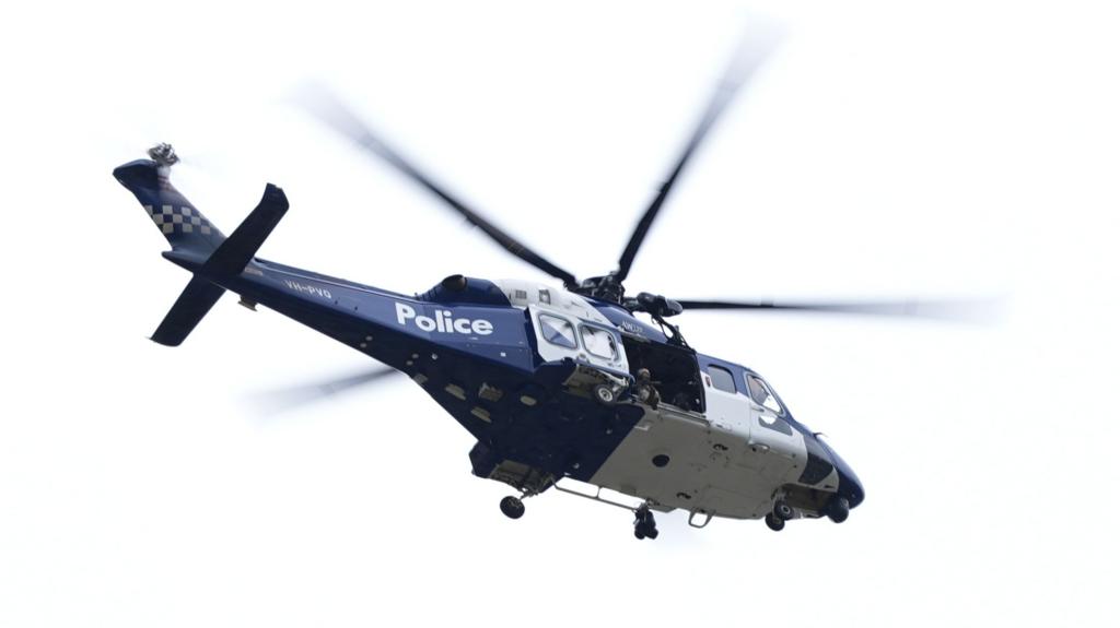 A police helicopter flying in the air