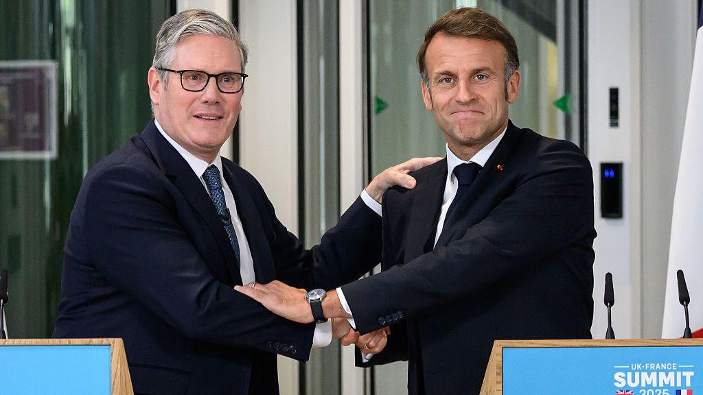 Sir Keir Starmer and French President Emmanuel Macron shake hands during the press conference at the Northwood Headquarters in London, England on 10 July 2025.