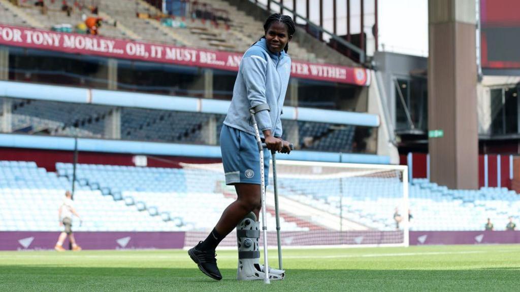 Khadija Shaw on crutches