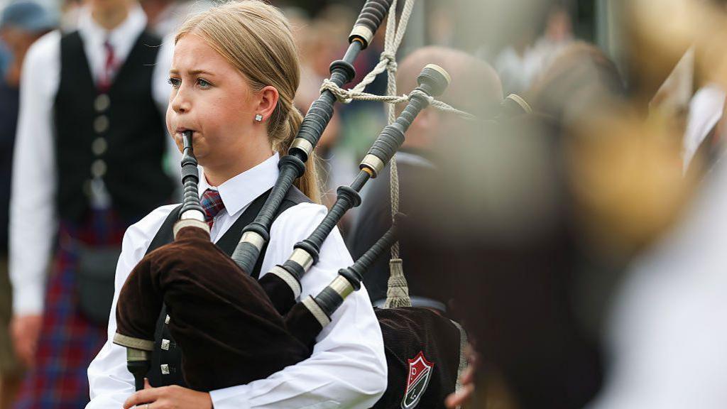 A girl playing the pipes