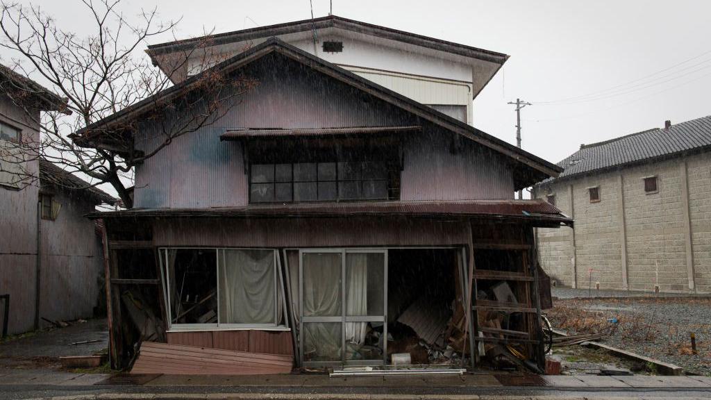 An abandoned house sits along the main street in Fukushima prefecture