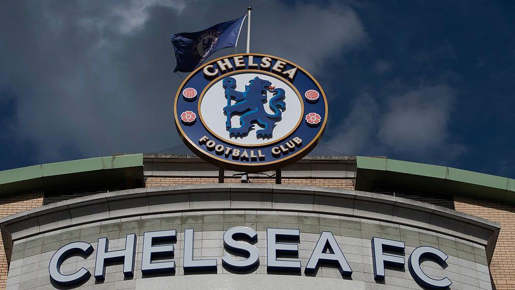 A Chelsea badge on the front of Stamford Bridge