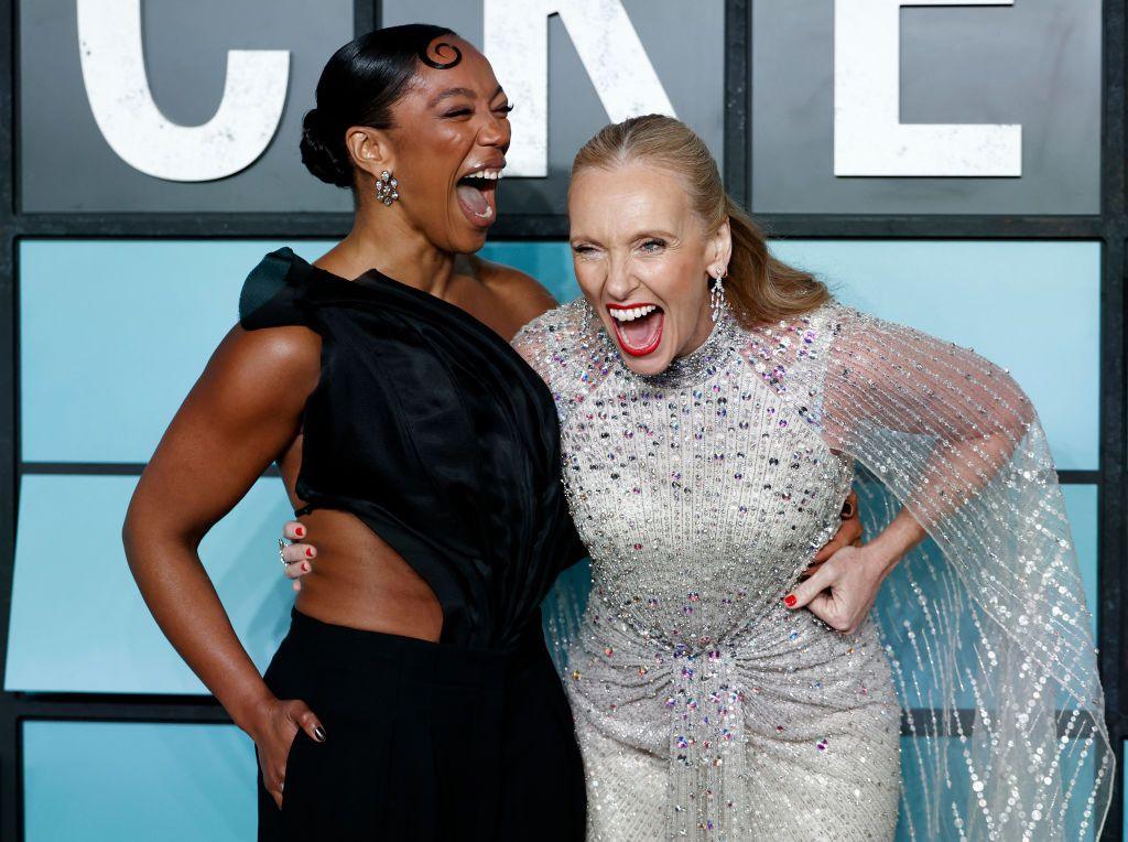 Naomi Ackie  and Toni Collette laugh as they pose for photographers 