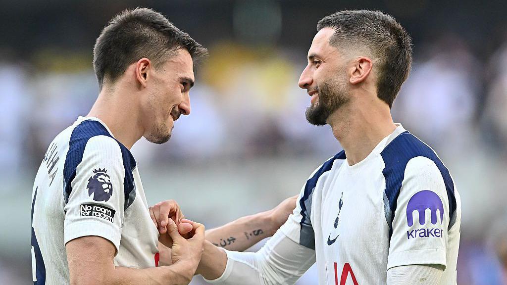 Joao Palhinha and Rodrigo Bentancur congratulate each other after the full-time whistle