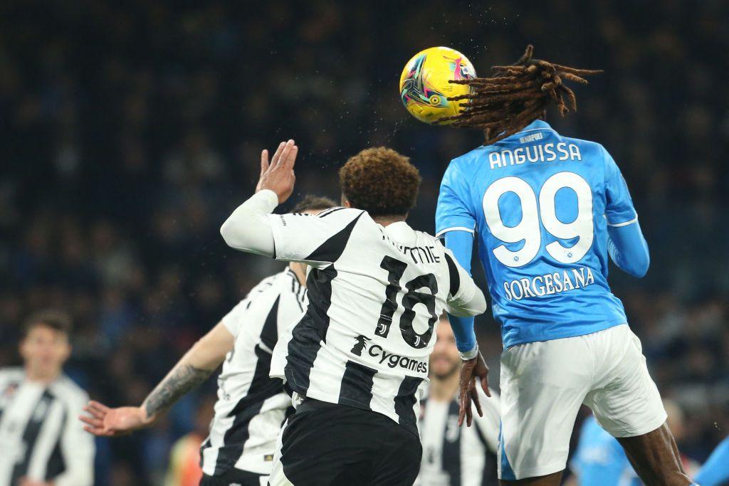 Napoli midfielder Frank Anguissa contests a header with Juventus midfielder Weston McKennie during a Serie A match at Stadio Diego Armando Maradona.