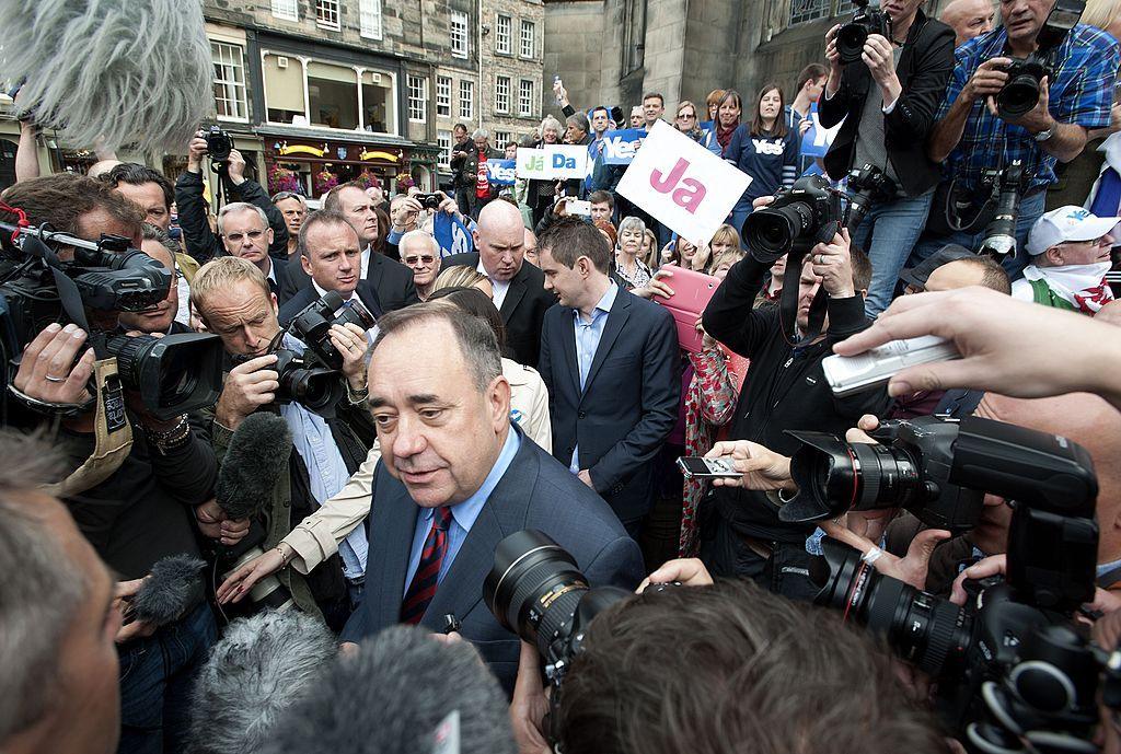 Salmond in Parliament Square, Edinburgh, surrounded by journalists and pro-independence campaigners carrying "yes" placards