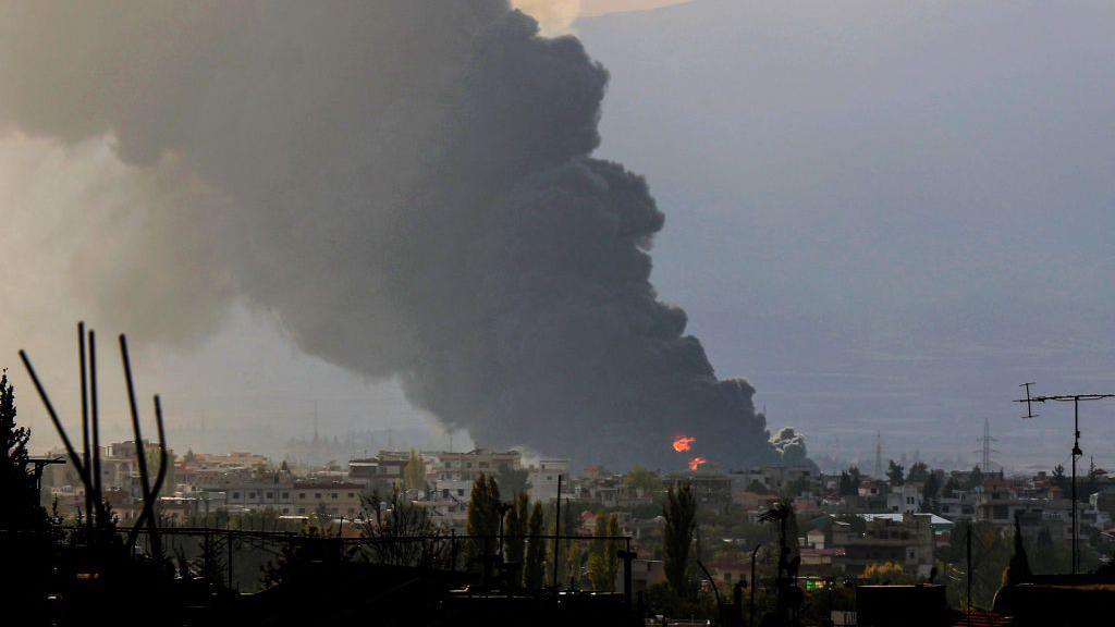 Smoke rises from the site of an Israeli air strike near the city of Baalbek, in the Bekaa Valley, eastern Lebanon (30 October 2024)