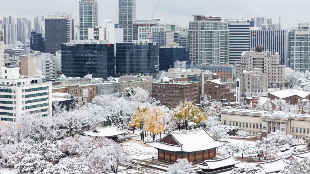 Commercial buildings during the first snow of the season in Seoul