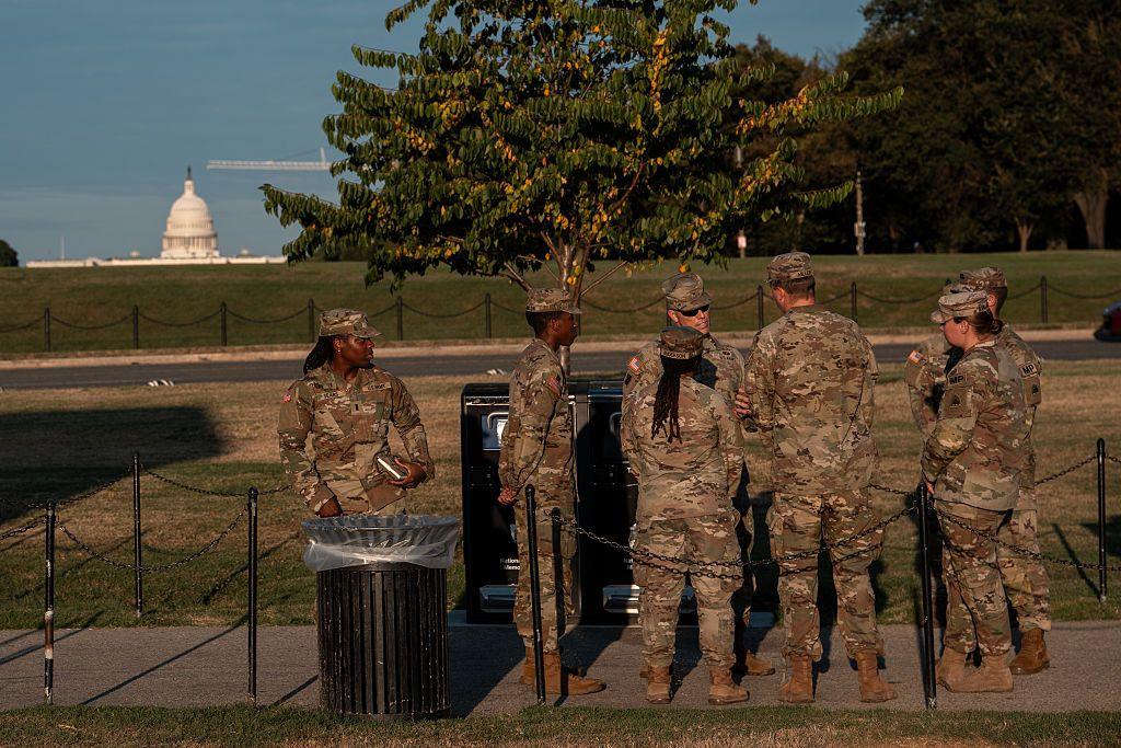 Troops seen standing with the US Capitol building in the background