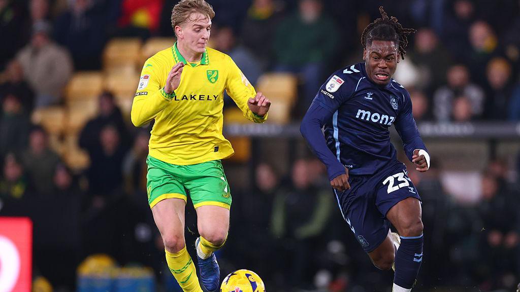 Brandon Thomas-Asante battles with Norwich City's Pelle Mattsson for the ball during the game at Carrow Road