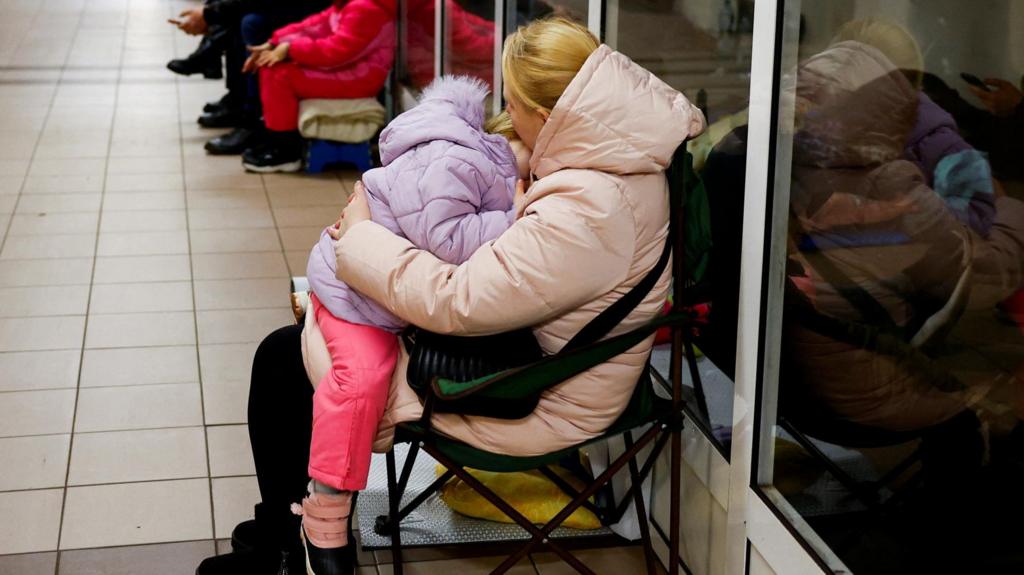 Woman and child sheltering in Kyiv metro