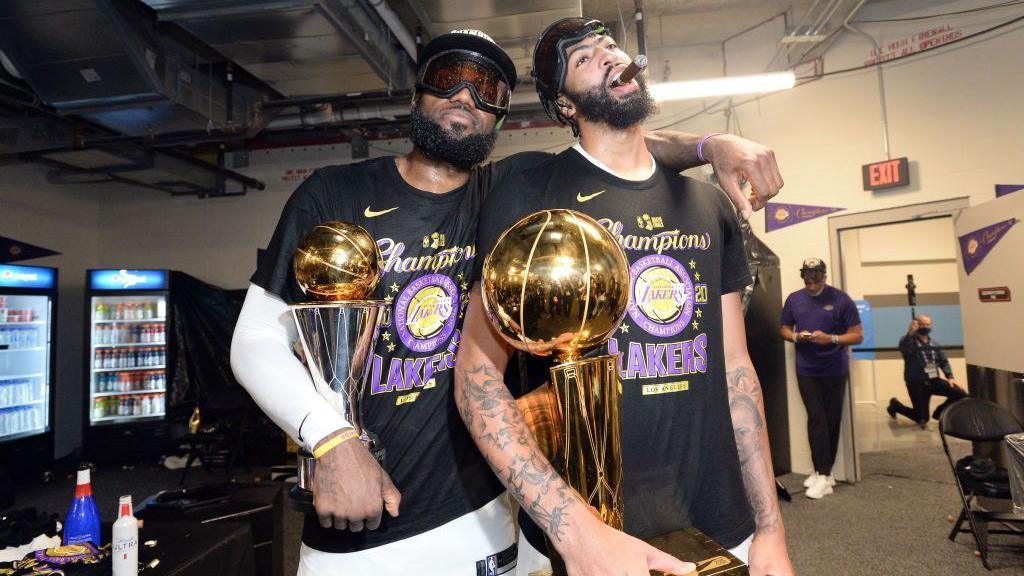 LeBron James and Anthony Davis smoking cigars after winning the 2020 NBA Championship