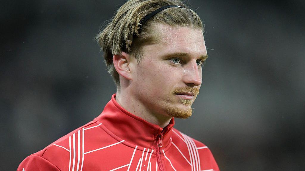 Close up of Dennis Cirkin with red Sunderland training jacket visible to shoulders