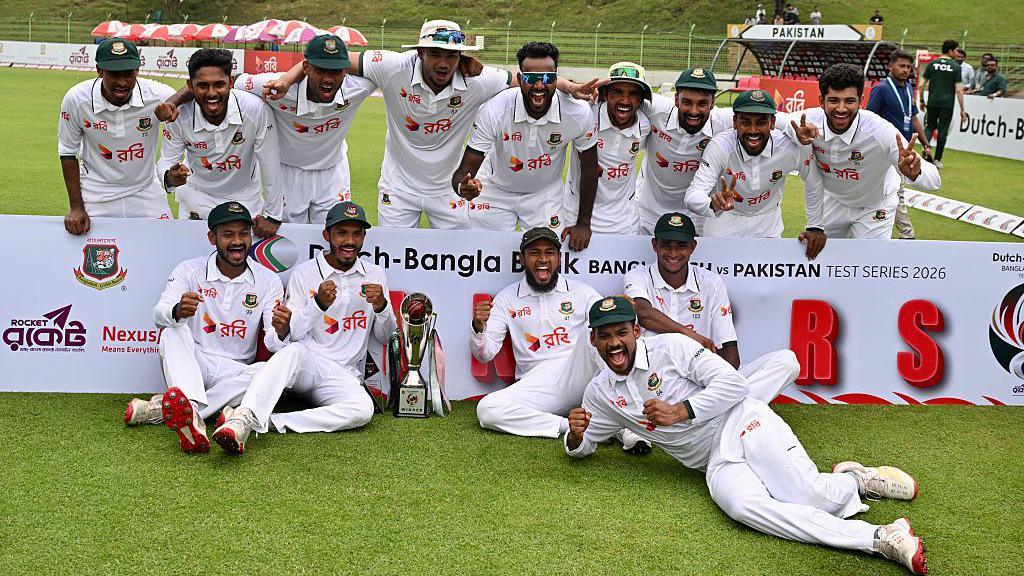 Bangladesh celebrate with the Test trophy