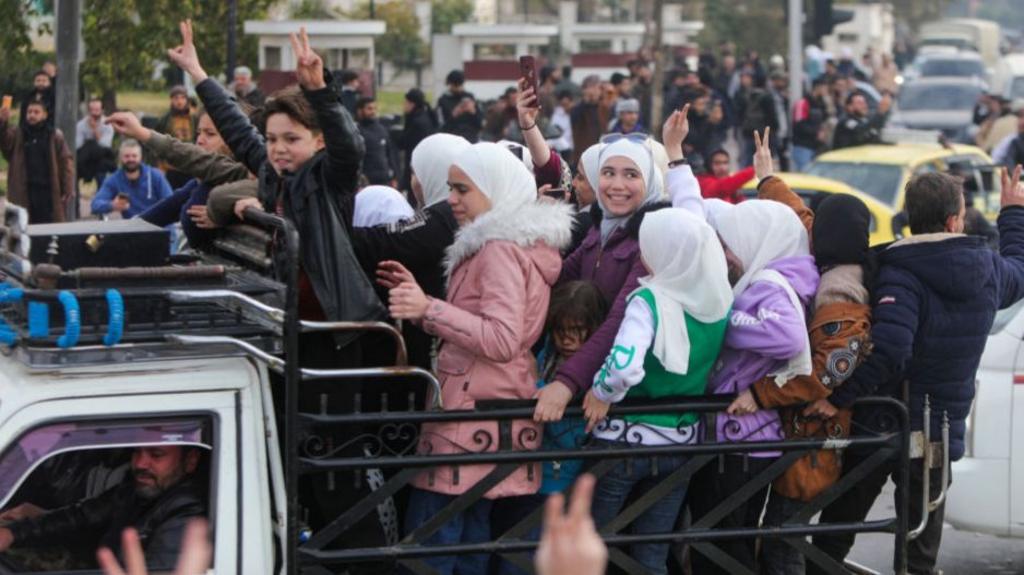 People celebrating in Damascus on Sunday