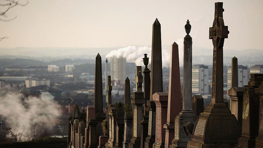 A row of graves at the Necropolis cemetery, which is on top of a hill, with the city lying behind and below