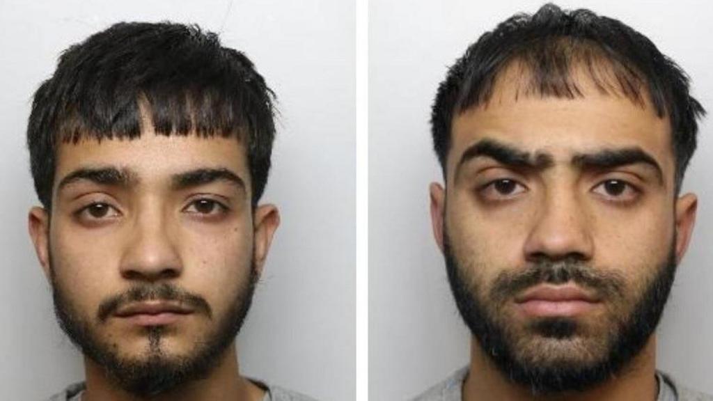 Mugshots of two men with black hair and beards