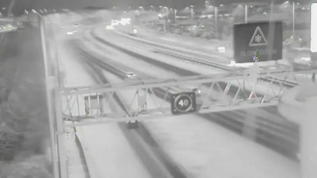 A motorway camera image showing snow on the M5.