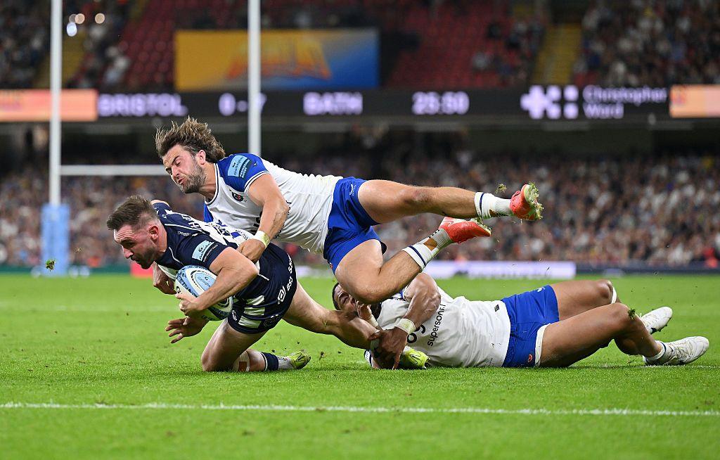 Two Bath players attempt to tackle Bristol's Richard Lane at Cardiff's Principality Stadium