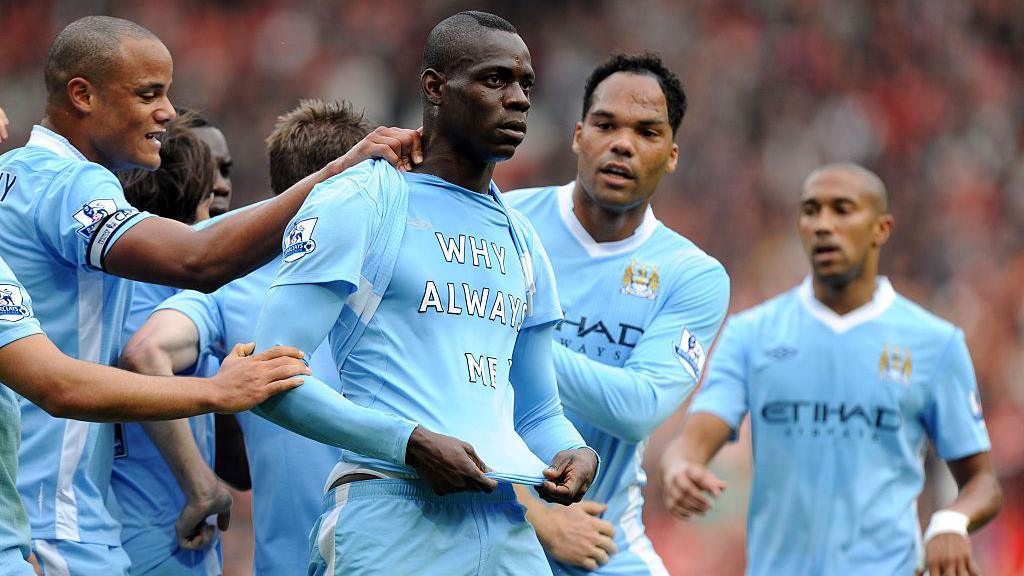 Mario Balotelli reveals a t-shirt asking 'Why always me?' at Old Trafford in October 2012.