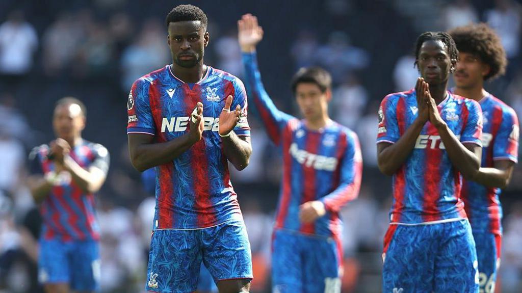 Palace players applauding their away support
