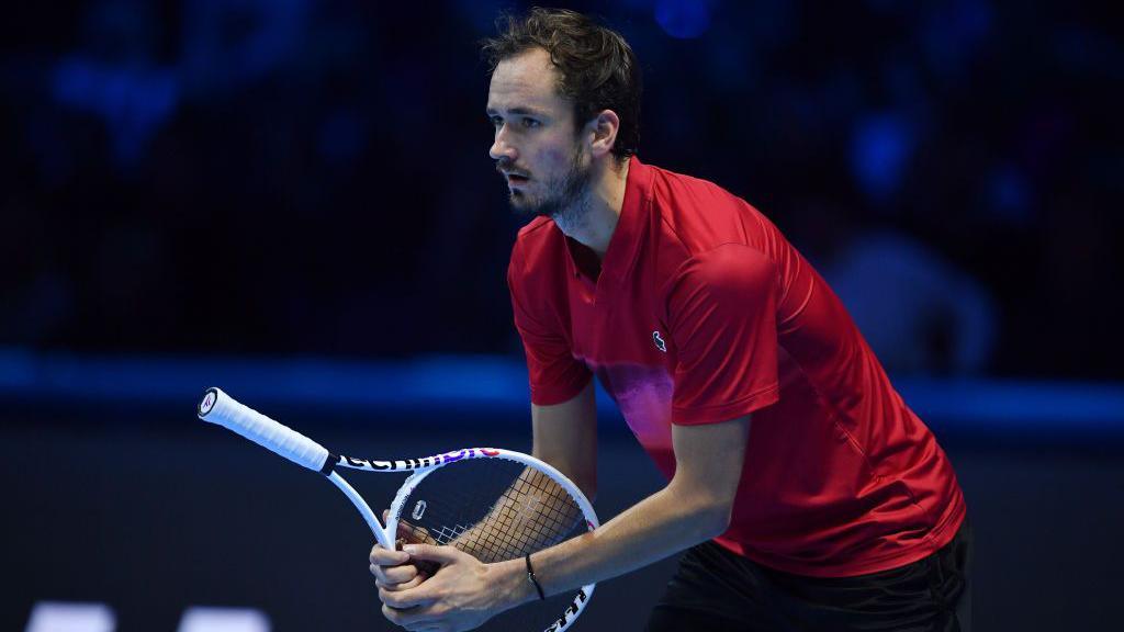 Daniil Medvedev holds his racquet upside down