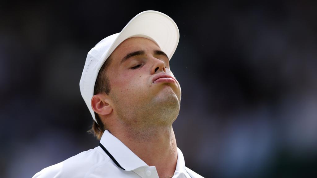 Arthur Fery competing on Centre Court at Wimbledon