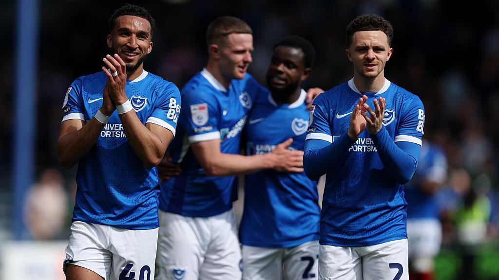 The Portsmouth players celebrate after beating Leicester
