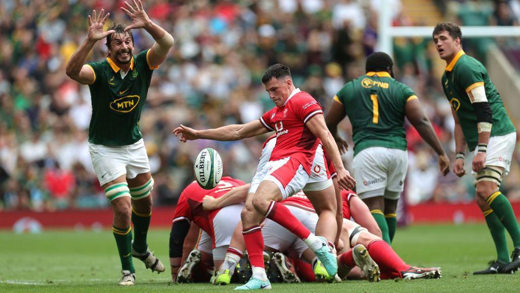 Ellis Bevan kicks the ball against South Africa