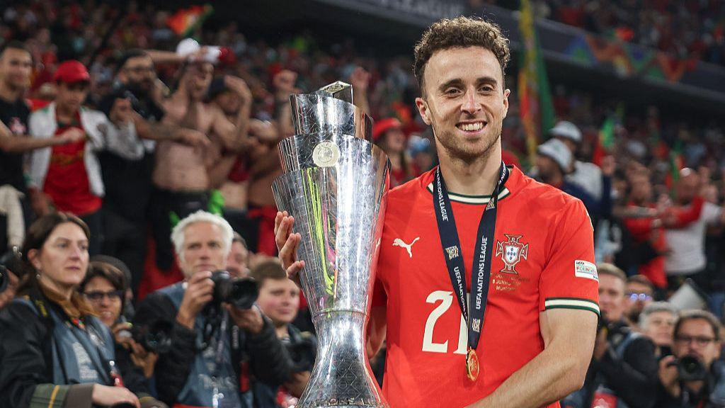 Diogo Jota of Portugal poses with the Uefa Nations League trophy after his team's victory in the final against Spain