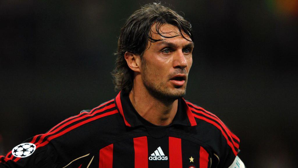 Paolo Maldini wearing a red and black AC Milan shirt