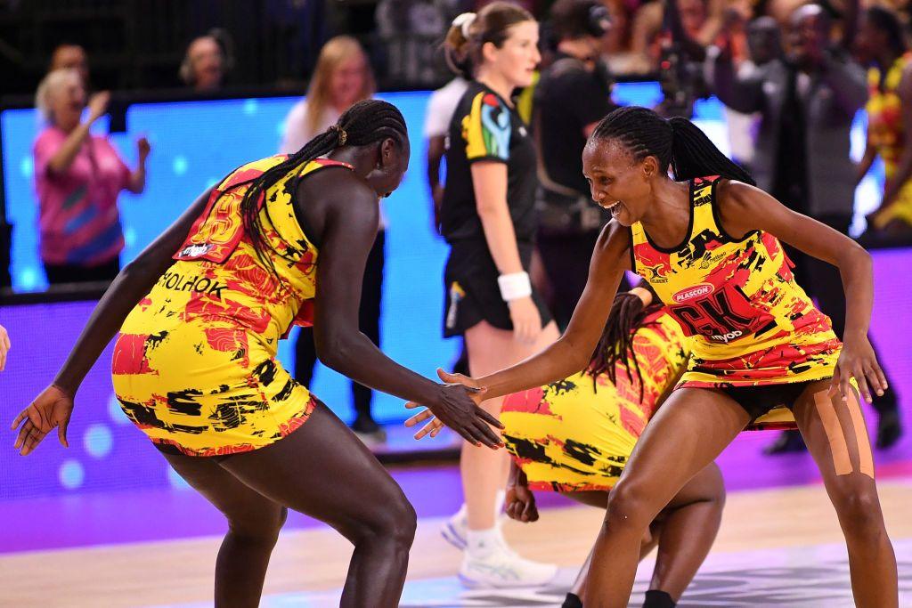 Players give each other high-fives and dance.