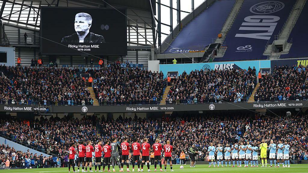 Players, fans, officials observe a minutes applause in memory of Ricky Hatton, prior to the Premier League match
