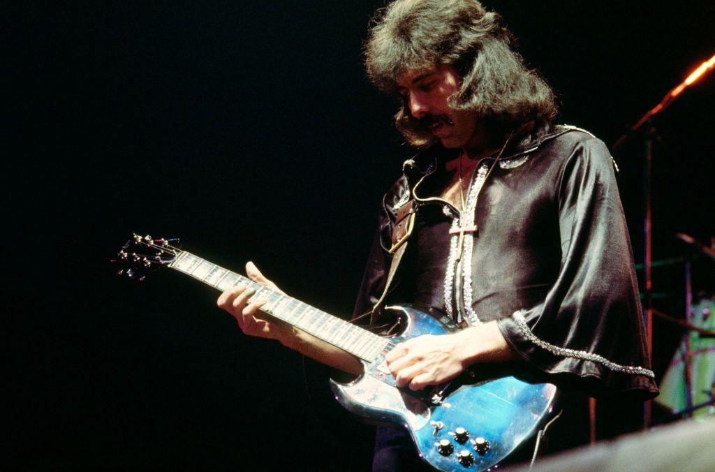 Tony Iommi plays guitar