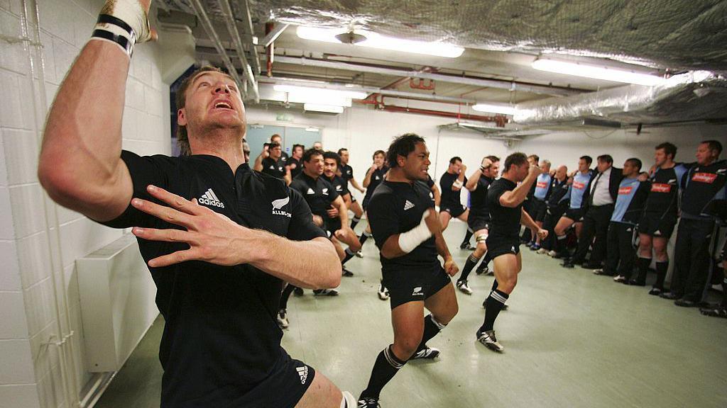 Ali Williams (L) and the All Blacks perform the Haka in the dressing prior to the international rugby match between Wales and New Zealand at the Millennium Stadium, 25 November 2006 in Cardiff,